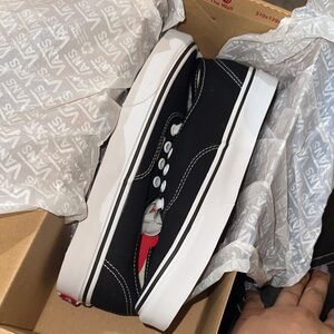Vans Black and White Low-Top Canvas Sneakers